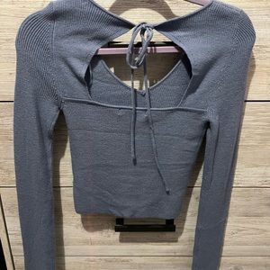 Blue long sleeve shirt with tie in the back